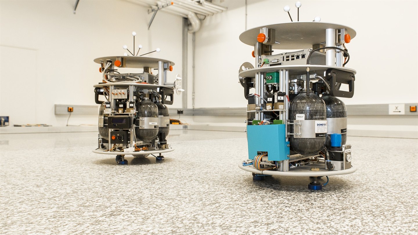 Two air-bearing vehicles with carbon-fibre gas bottles floating on the TEAMS granite floor